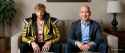 jimeng-2025-06-27-426-Two men sit on a cozy beige-walled couch, wearing yellow-black and blue outfit... (1)_thumb.jpg