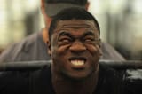 black guy lifts two crts