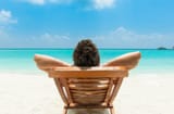 man-relaxing-beach-ocean-view-ma