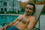 20250725_1017_Relaxing Poolside in Autumn_remix_01k10yvj6fevrtx9e40b9rm34p