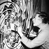 The_Artist_-_Maurits_Cornelis_Escher_-_working_at_his_Atelier_(50385403156)