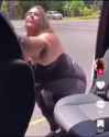 American woman takes a seat in the back of a vehicle_thumb.jpg