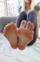 Blonde girl shows off her long toes on her pretty bare feet - Foot Fetish 1707159901077819_thumb.jpg