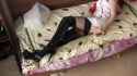Nurse Alice In Black Patent Overknee Boots On A Bed_thumb.jpg