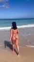 woman_beach_thick_frolic_water_thumb.jpg