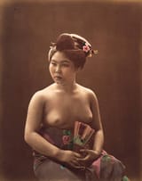 Topless_sitting_woman_holding_fan,_Japan,_circa_1880