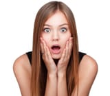 young-woman-holding-cheeks-in-surprise