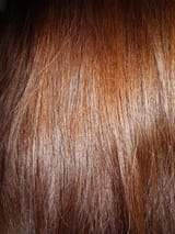 Woman_with_long_brown_hair,_close-up_view