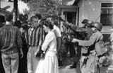 soldiers of the 101st airborne point bayonets at schoolchildren