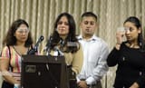 The Syriani children giving a press conference prior to their father&#039;s execution, Sarah at the microphone