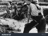 stock-photo-convict-chain-gang-and-prison-guard-in-oglethorpe-county-georgia-may-242816197[1]