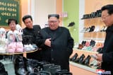 Kim Inspects Shoe Store