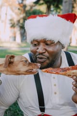 santa feeding dog