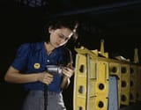 Operating_a_hand_drill_this_woman_worker_is_shown_working_on_the_horizontal_stabilizer