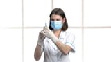 nurse getting ready to inject OP
