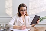 businesswoman making handwritten notes