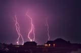 lightning over houses
