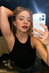 20250617_2316_Bar Bathroom Selfie_remix_01jy0gfpkxfx9rpb4ef7k0nasf