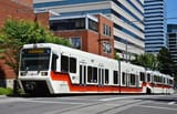 Portland_MAX_train_of_Type_2_+_Type_1_cars_at_5th_&amp;_Mill_(2015)