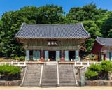 Front_exterior_view_of_Beomeosa_temple_with_three_stairs_and_blue_sky_in_Busan_South_Korea