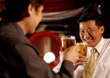 Two-men-drinking-beer-together-in-Hong-Kong--1200x853