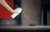 hand-spraying-insecticide-over-cockroach-260nw-2099808805~2