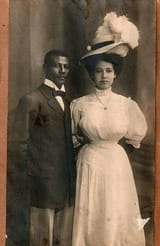 1900s-noir-couple-white-dress-hat-suit-men-1-1975408673
