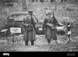 unidentified-re-enactors-dressed-as-german-infantry-wehrmacht-soldier-at-world-war-ii-are-on-patrol-in-autumn-field-2C4DK5P