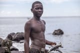 Comorian-boy-with-fish-in-his-hands-Moroni-Comoros