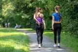 back-view-two-attractive-fitness-girls-going-jogging-public-park-sunny-morning_627281-1577