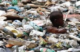 the-brazilian-slum-children-who-are-literally-swimming-in-garbage-1413262484453