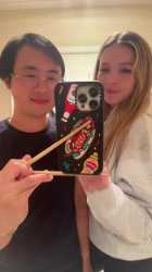 chinese_man_chopsticks_phone_thumb.jpg