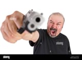 big-man-with-angry-eyes-points-his-gun-to-your-face-looks-very-angry-DEYDB4