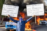 84113530007-waymo-fire-la-ice-protests-02