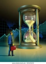 businessman-looking-giant-hourglass-digital-600w-105243233