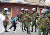 Kenya_Haiti_Police_beats_local_hippy