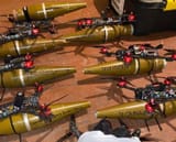 The-six-quadcopters-with-the-RPG-7-rounds-strapped-underneath-them[1]