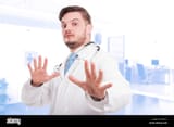 young-scared-doctor-with-uniform-and-stethoscope-doing-refusal-gesture-J3A61C