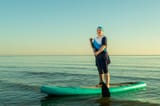 woman-muslim-burkini-paddling-sup-board-sea-against-sunrise-sky-woman-muslim-burkini-paddling-sup-board-sea