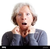 frightened-elderly-woman-looking-surprised-and-shocked-FA1MCC