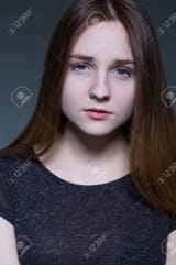 55595250-portrait-of-a-young-sad-girl-looking-at-the-camera