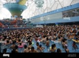 file-holidaymakers-crowd-a-swimming-pool-to-cool-down-in-an-indoor-water-park-at-the-national-aquatics-center-also-known-as-the-water-cube-in-bei-W8Y2AN[1]
