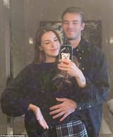 67340331-11715207-LOve_The_footage_showed_the_happy_couple_reading_the_positive_pr-a-32_1675600867898