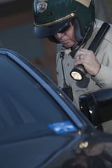 cop-flashlight-investigating-car-middle-aged-traffic-33897261