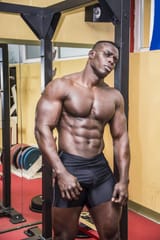 handsome-black-male-bodybuilder-resting-workout-gym-looking-camera-52007917 (1)