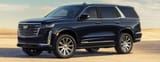 Front-three-quarters-view-of-the-2023-Cadillac-Escalade-parked_o-1