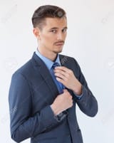 68555190-serious-elegant-business-man-adjusting-tie