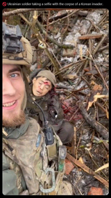 🚫 Ukrainian soldier taking a selfie with the corpse of a Korean invader