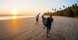 surfers_at_the_beach_sunset_costa_rica