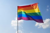 waving-rainbow-flag-sky-scaled